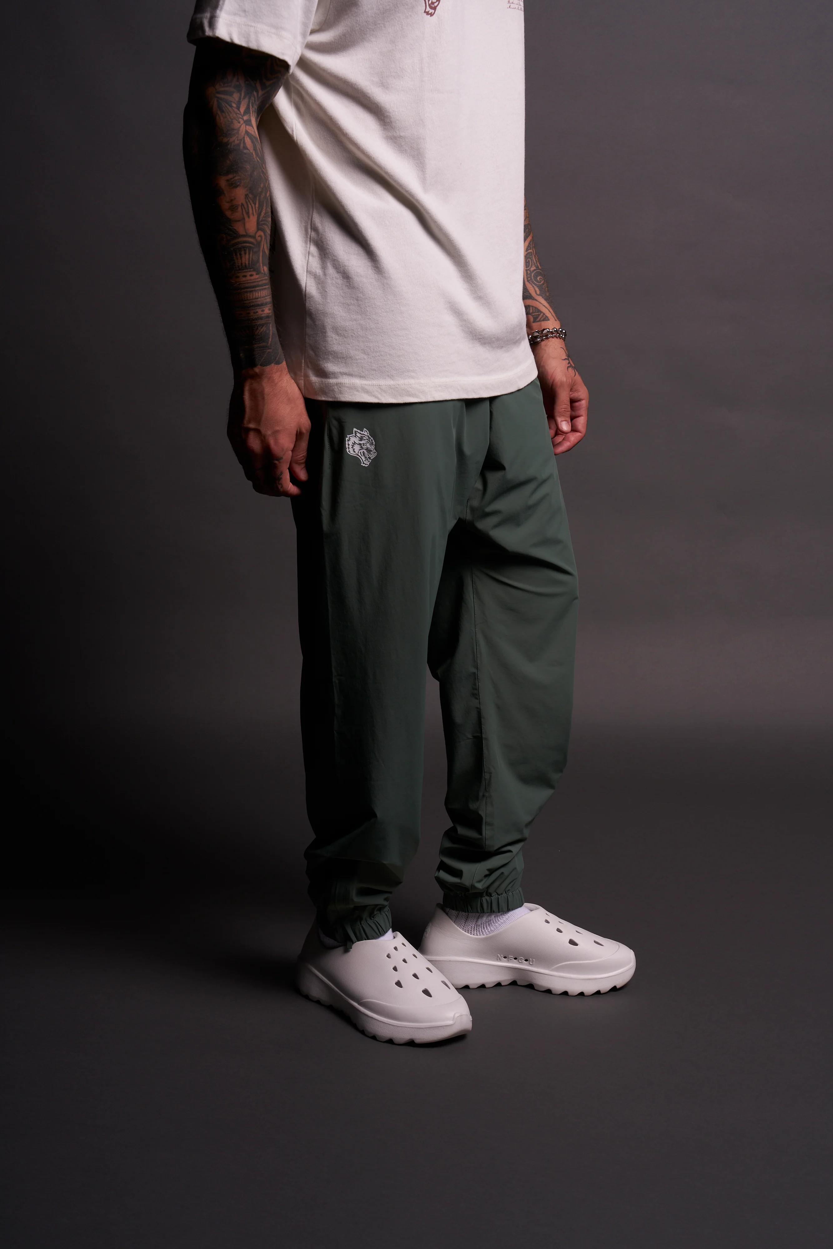Dual Wolf Head Hybrid Nylon Track Pants in Hunter Green - Image 4