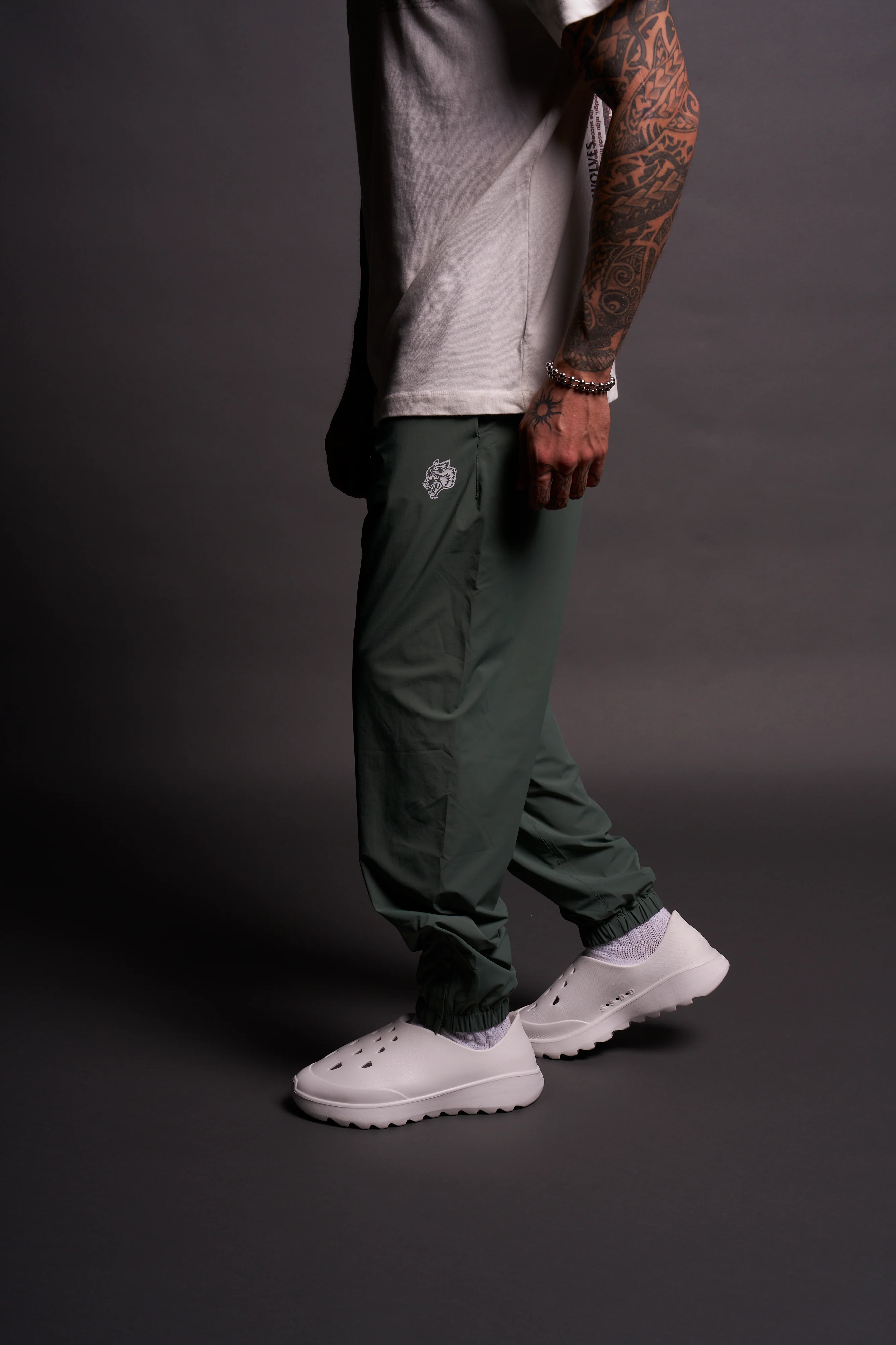 Dual Wolf Head Hybrid Nylon Track Pants in Hunter Green - Image 9